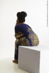 Dina Moses African Woman Sitting Pose